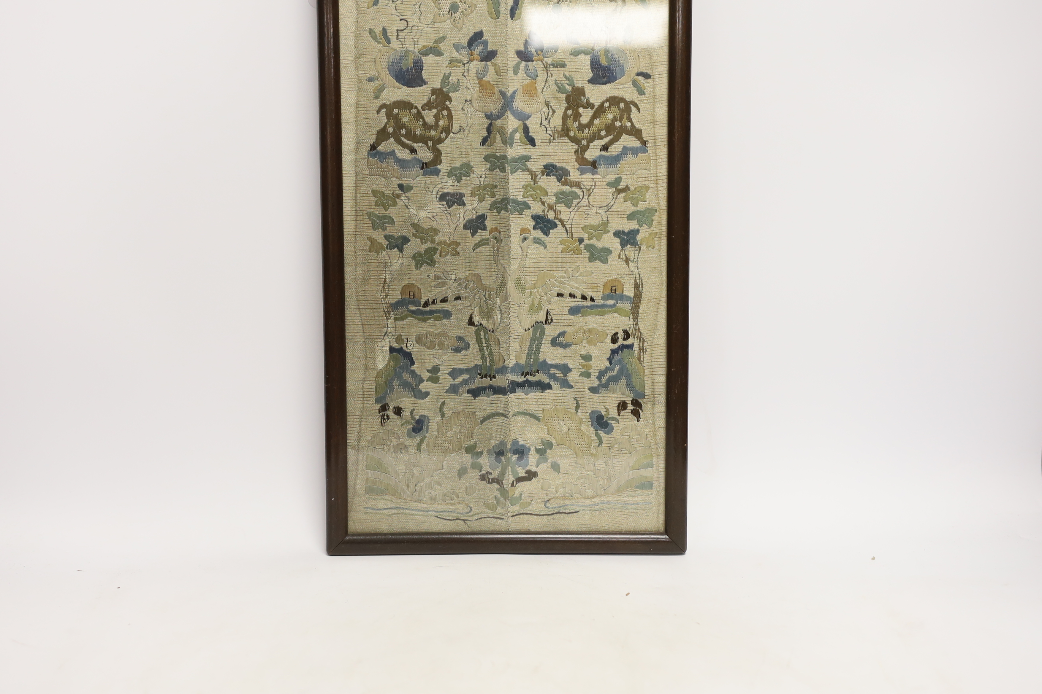 A framed pair of Chinese floral silk embroidered sleeve bands, embroidered with Chinese knot and stem stitch, 19cm wide x 50cm high